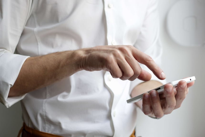 person holding and scrolling on a phone