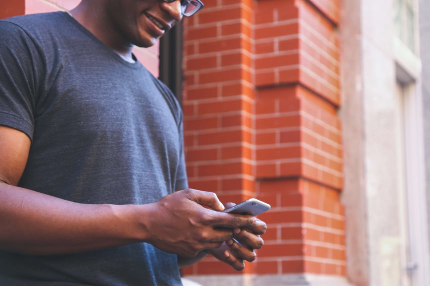 man texting on his phone